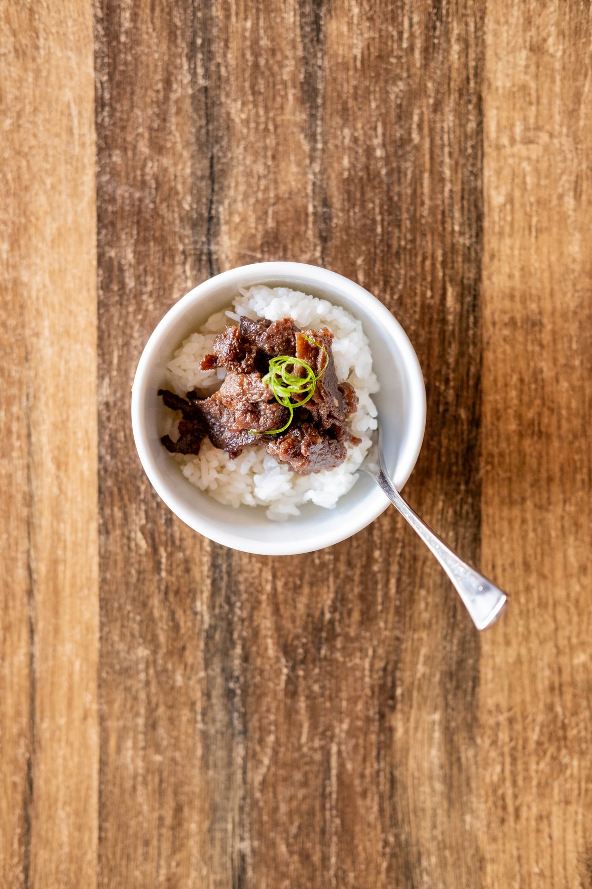Beef bulgogi served on rice in an individual bowl